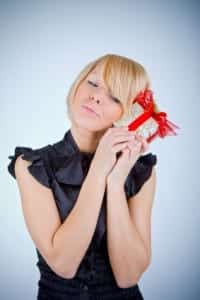 young woman with a little present in her hands 