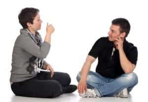 a man and a woman sitting and talking