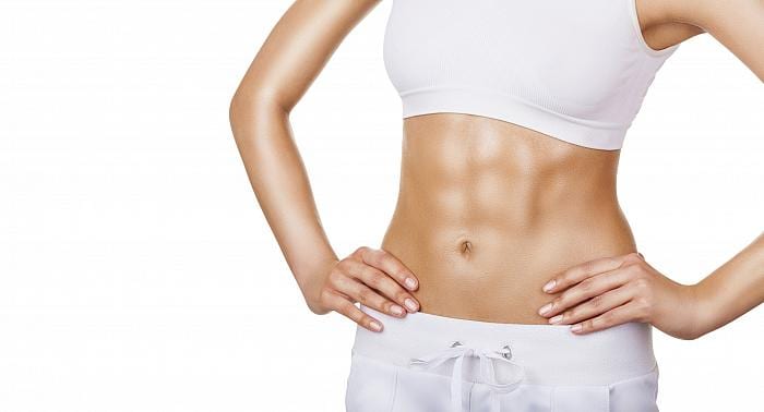 middle part of a woman's body with white underwear and abs with a strong abdominal muscles 