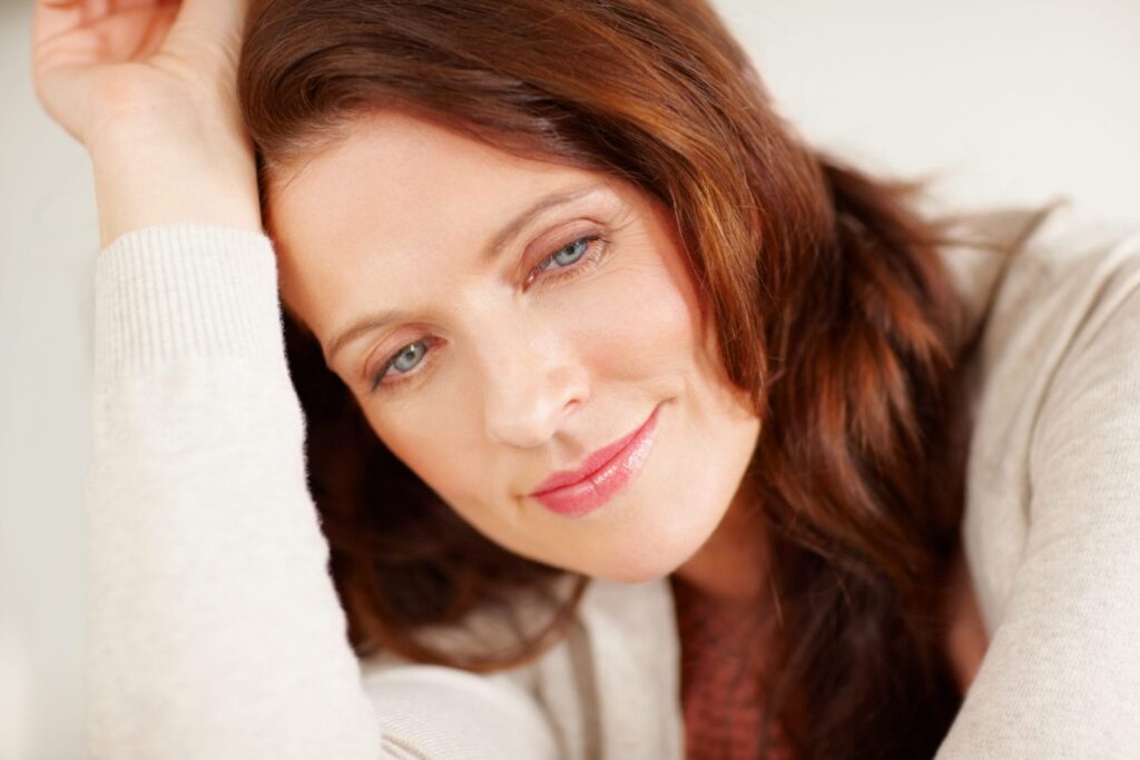 Closeup of a woman having a happy thought