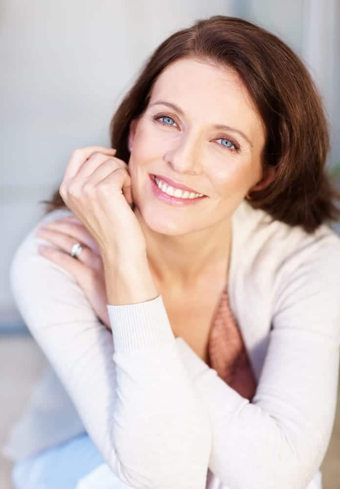 beautiful middle aged woman's face smiling 