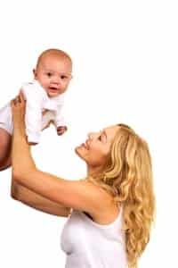 mother holding baby above her head