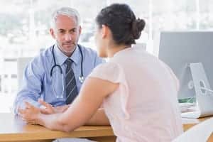 patient and doctor talking at the office