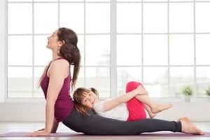 woman doing a yoga position at the gym