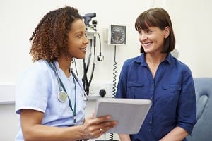 woman talking with a female doctor at the office