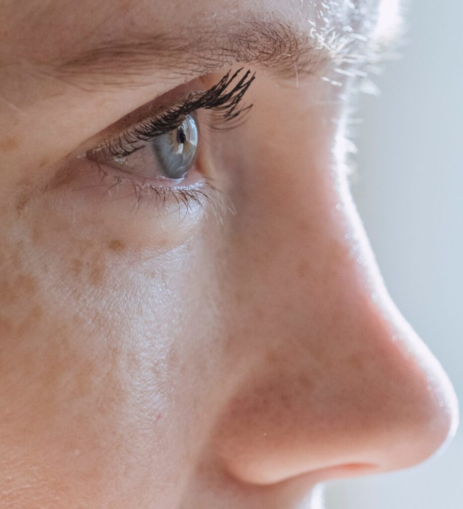 side profile close-up of a woman's eyes and nose