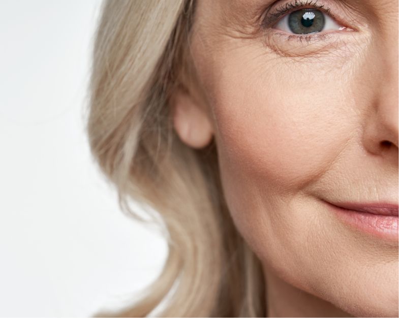 close up of older women smiling and looking at the camera
