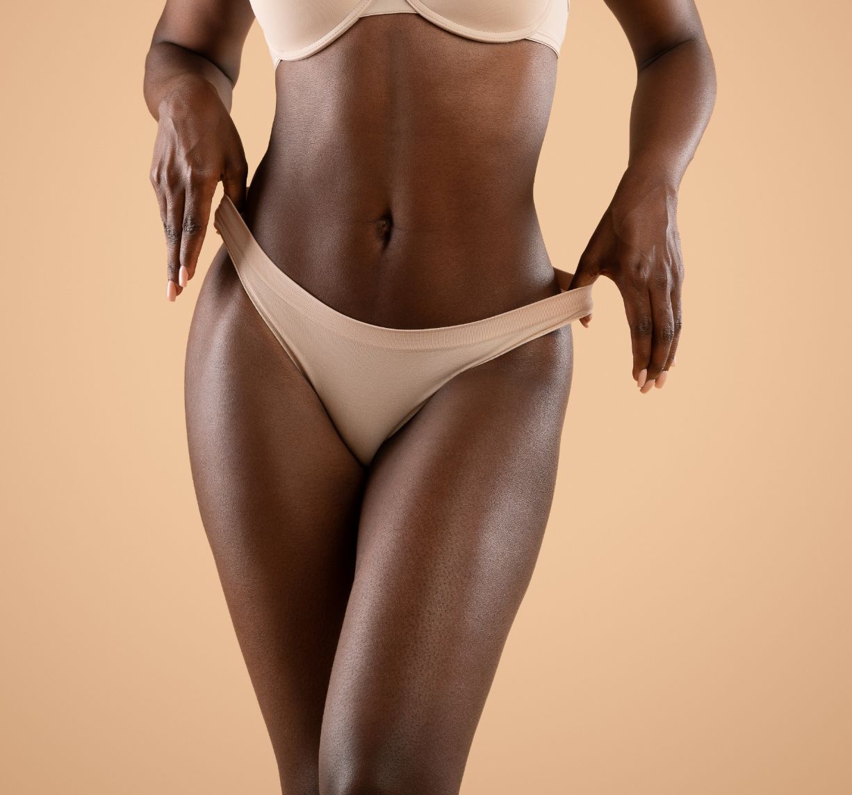 young woman in nude color under garment