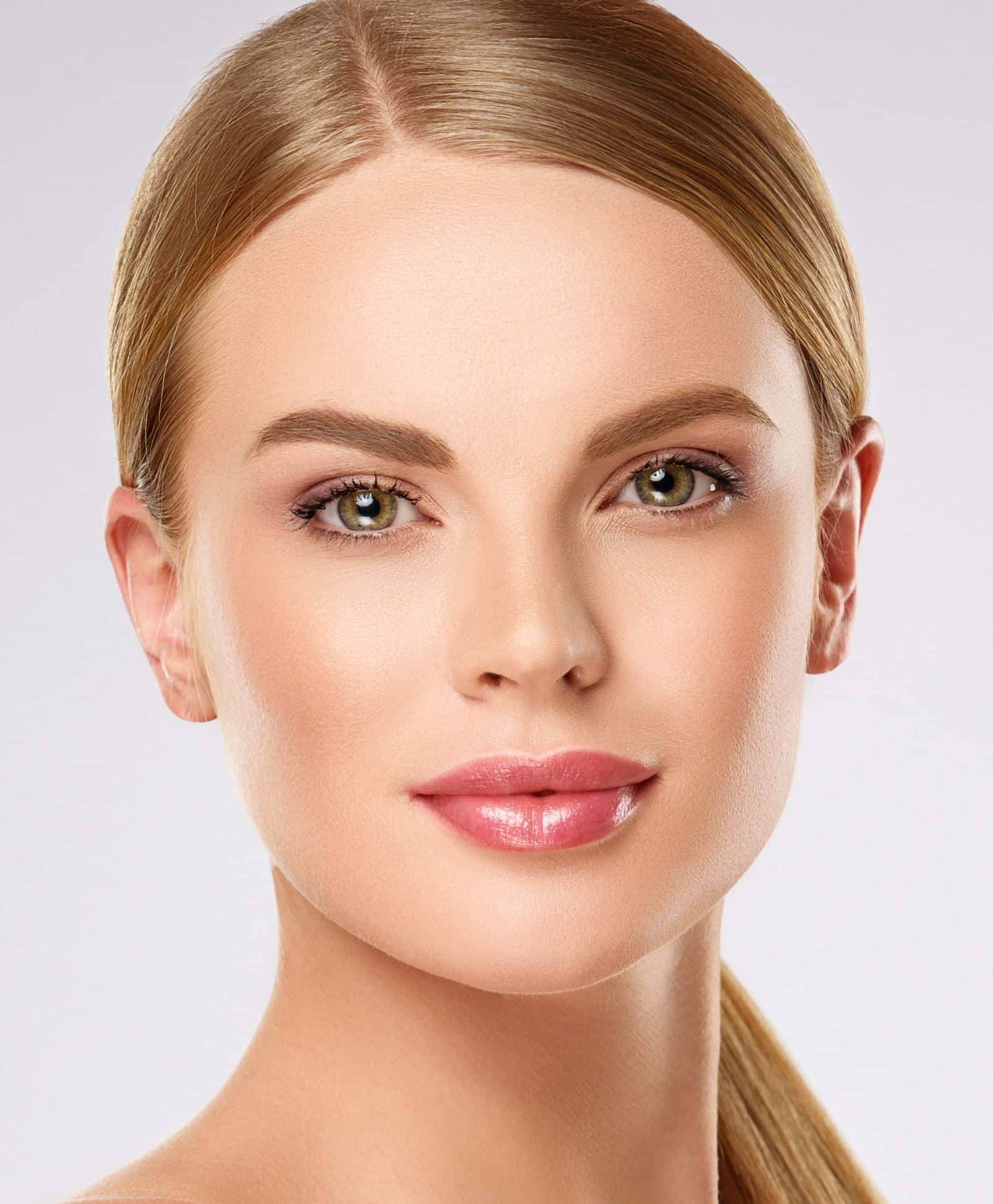 Female face close up photo with light make up on