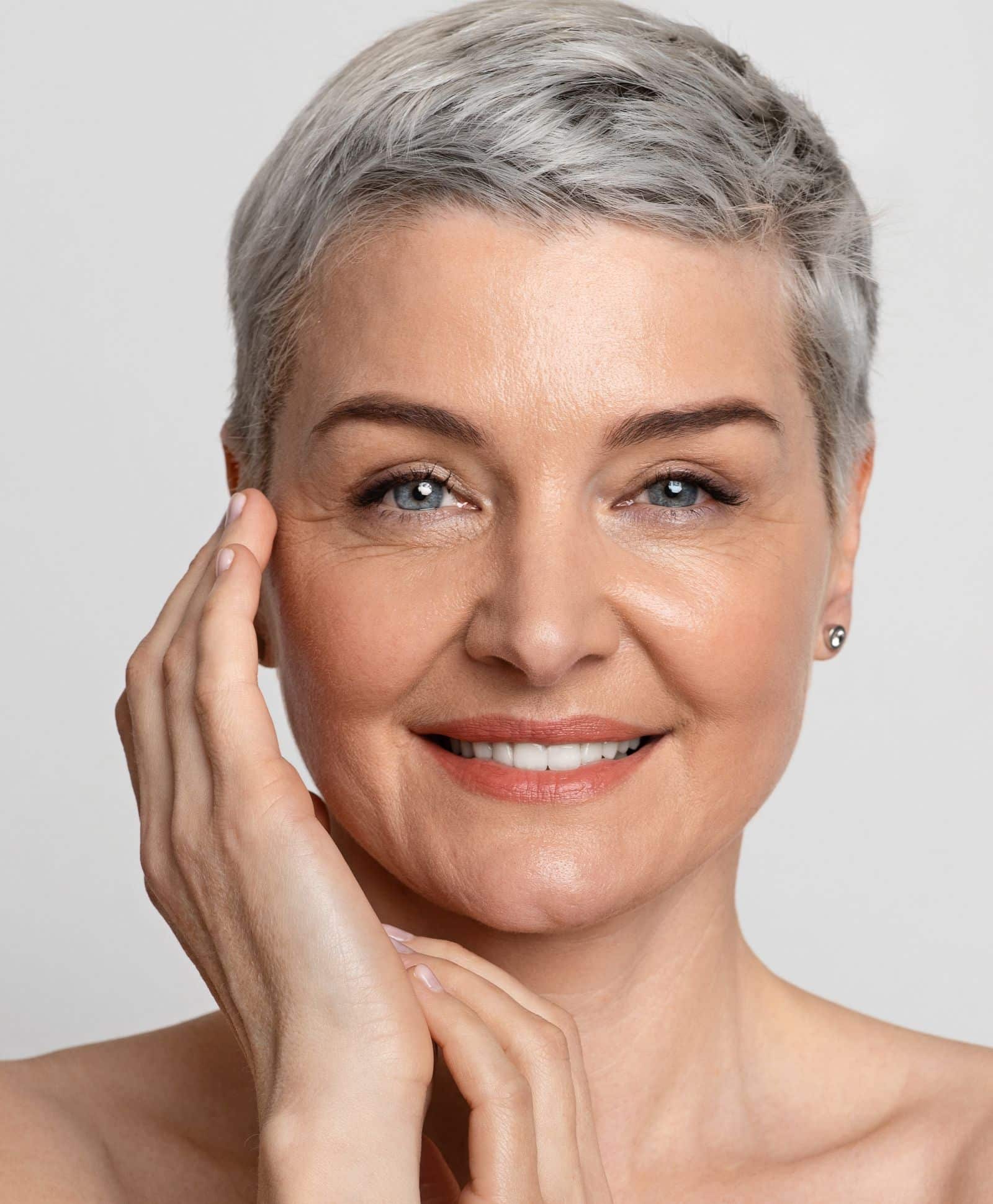 Mid age female with grey short hair