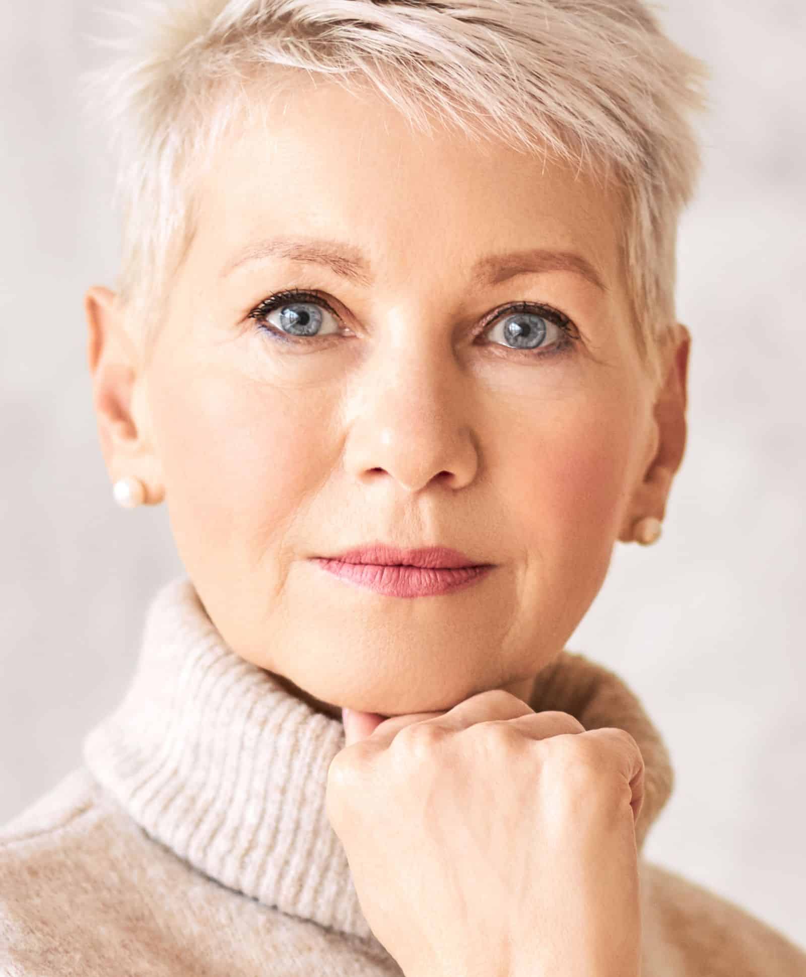 Mature woman with smooth, radiant skin after Fraxel skin resurfacing treatment, highlighting reduced fine lines and improved skin texture.